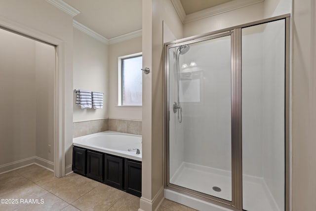 113 Gilmore Rd, Youngsville, LA 70592 - bathroom with a stall shower, crown molding, a bath, tile patterned flooring, and baseboards