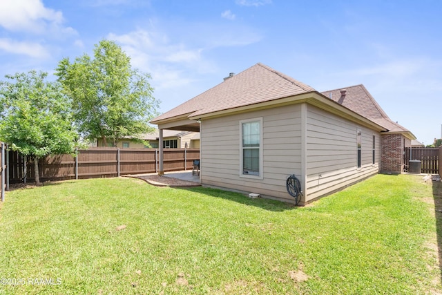 113 Gilmore Rd, Youngsville, LA 70592 - back of house featuring roof with shingles and cooling unit