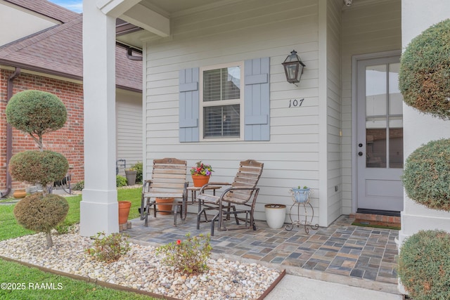 107 Harbor Walk Dr, Lafayette, LA 70508 - property entrance with roof with shingles and brick siding