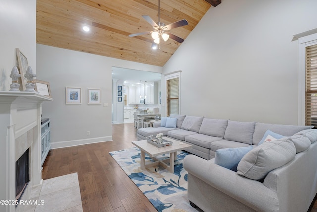 107 Harbor Walk Dr, Lafayette, LA 70508 - living room featuring a high end fireplace, a ceiling fan, high vaulted ceiling, baseboards, and wood ceiling