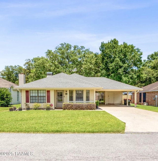 211 Dartmoor Dr, Lafayette, LA 70506 - single story home with driveway, a front yard, a chimney, an attached carport, and roof with shingles