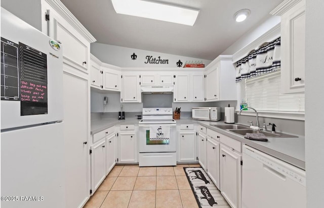 211 Dartmoor Dr, Lafayette, LA 70506 - kitchen featuring white appliances, under cabinet range hood, lofted ceiling, a sink, and white cabinets