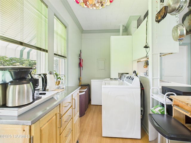 1635 Myrtle Pl, Lafayette, LA 70506 - washroom featuring washing machine and dryer, ornamental molding, and light wood-type flooring