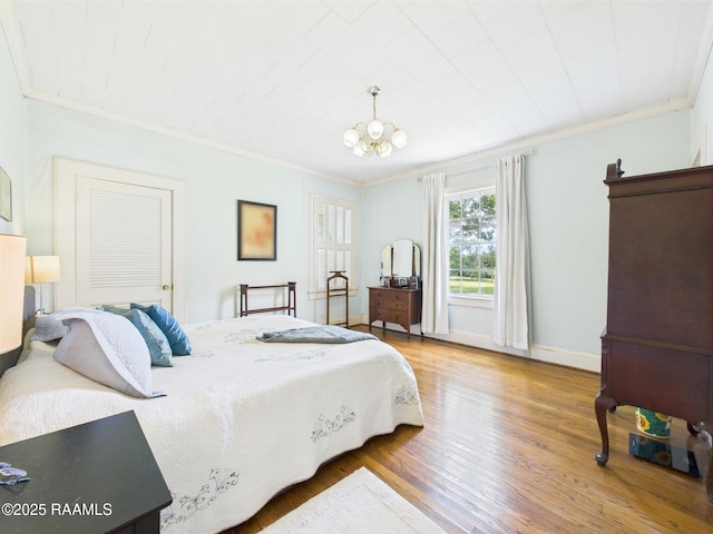 1635 Myrtle Pl, Lafayette, LA 70506 - bedroom with ornamental molding, wood finished floors, a chandelier, and baseboards