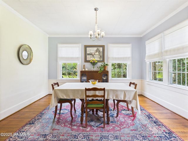 1635 Myrtle Pl, Lafayette, LA 70506 - dining space featuring a chandelier, healthy amount of natural light, crown molding, and wood finished floors