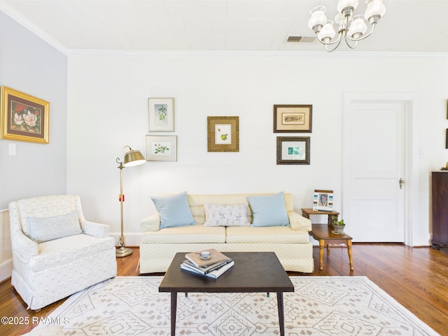 1635 Myrtle Pl, Lafayette, LA 70506 - living room with ornamental molding, a chandelier, wood finished floors, and baseboards