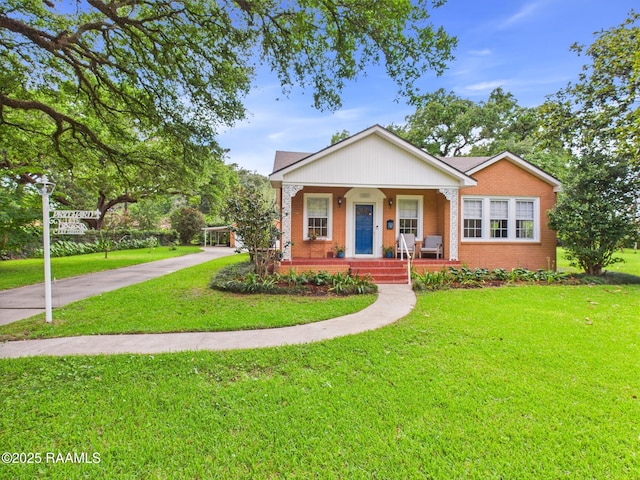 1635 Myrtle Pl, Lafayette, LA 70506 - bungalow-style home featuring covered porch, brick siding, and a front lawn