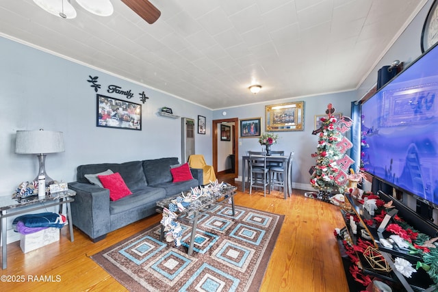 408 Loraine St, Abbeville, LA 70510 - living area featuring ornamental molding, wood finished floors, and a ceiling fan