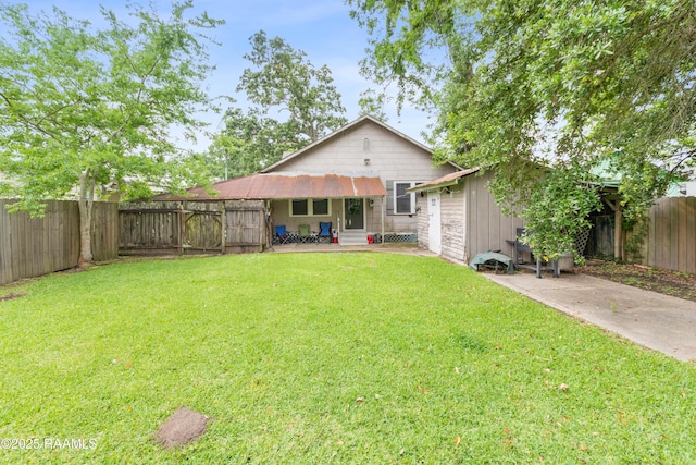 408 Loraine St, Abbeville, LA 70510 - rear view of house with entry steps and a patio area