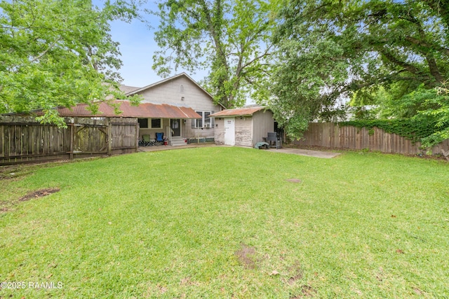 408 Loraine St, Abbeville, LA 70510 - view of yard featuring a storage unit, an outbuilding, and entry steps