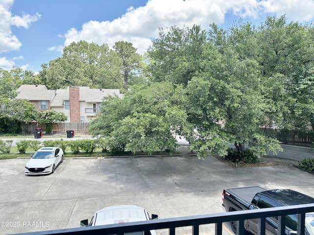 701 S College Rd Unit 208, Lafayette, LA 70503 - uncovered parking lot featuring fence
