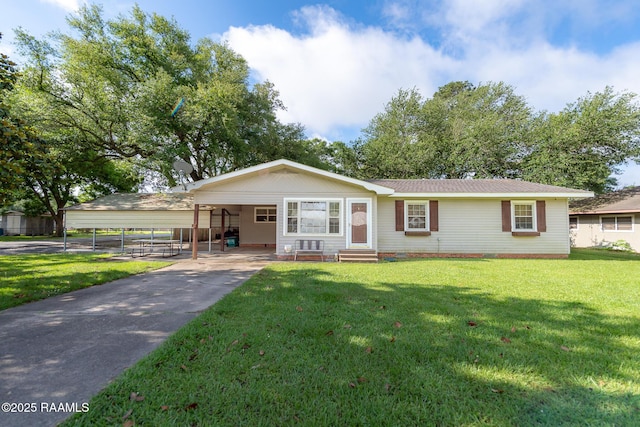 1301 Gregg Ave, Eunice, LA 70535 - ranch-style home featuring entry steps, a front lawn, driveway, and a carport