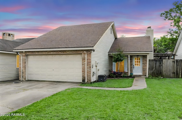 400 Mustang St, Lafayette, LA 70506 - view of front facade with a garage, concrete driveway, a chimney, a shingled roof, and central air condition unit
