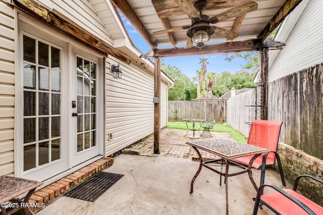 400 Mustang St, Lafayette, LA 70506 - fenced backyard with a patio area, ceiling fan, and french doors