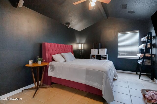 400 Mustang St, Lafayette, LA 70506 - tiled bedroom featuring baseboards, a textured ceiling, and a ceiling fan