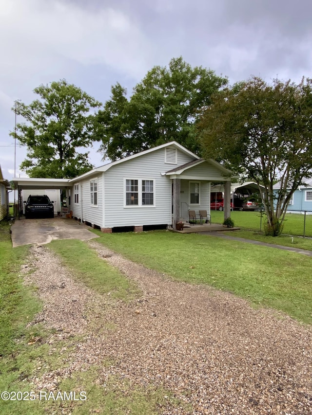 808 6th St, Rayne, LA 70578 - view of front of house featuring driveway and a porch