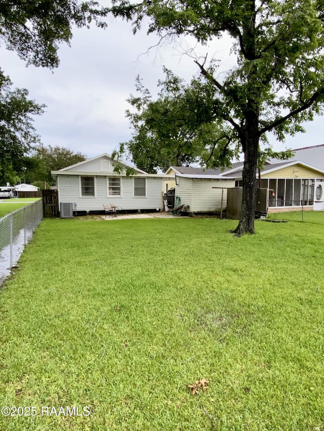808 6th St, Rayne, LA 70578 - view of yard with a sunroom and central AC