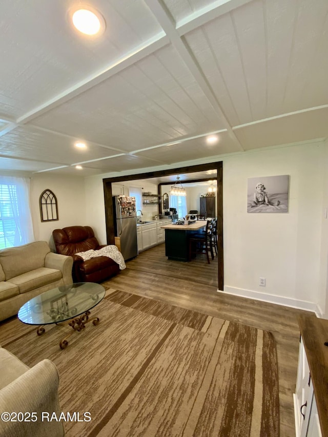 808 6th St, Rayne, LA 70578 - living area with dark wood-style floors, baseboards, and a chandelier