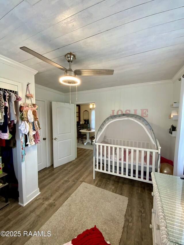 808 6th St, Rayne, LA 70578 - bedroom with wood finished floors, crown molding, and a closet