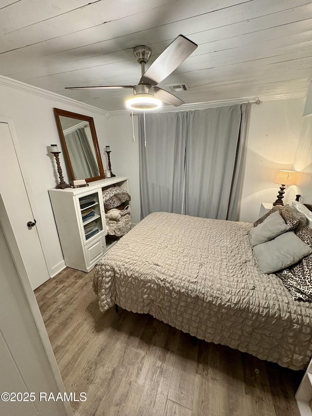 808 6th St, Rayne, LA 70578 - bedroom featuring wood finished floors, ornamental molding, and ceiling fan