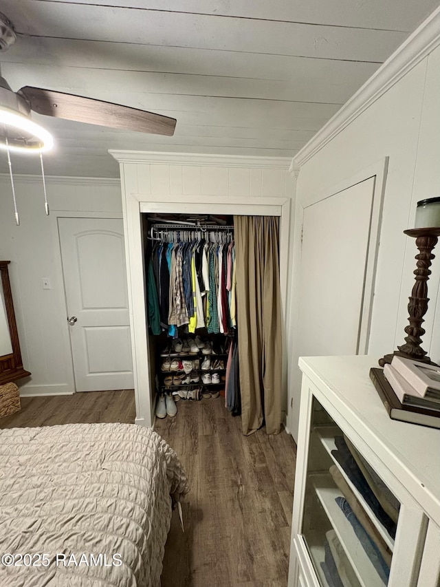 808 6th St, Rayne, LA 70578 - bedroom featuring wood finished floors, crown molding, and a closet
