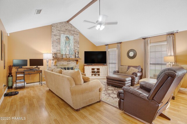 116 Twin Lakes Dr, Youngsville, LA 70592 - living room with ceiling fan, light wood-style flooring, a fireplace, and baseboards