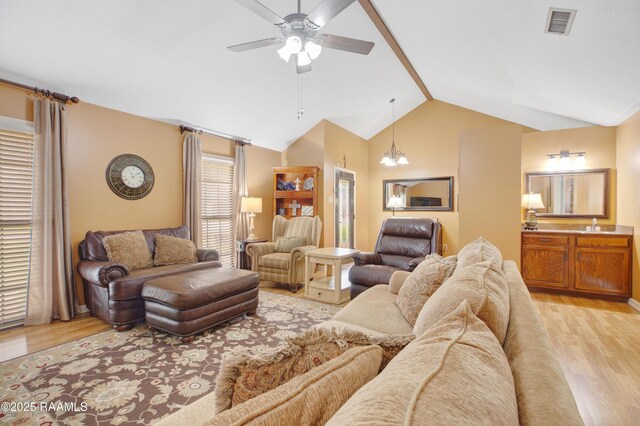116 Twin Lakes Dr, Youngsville, LA 70592 - living area featuring light wood finished floors, vaulted ceiling, and ceiling fan