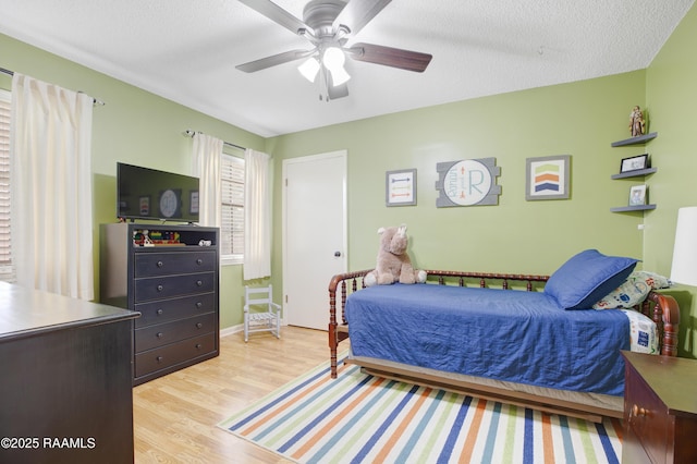116 Twin Lakes Dr, Youngsville, LA 70592 - bedroom featuring light wood-type flooring, baseboards, and a ceiling fan