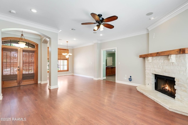 103 Barronne St, Lafayette, LA 70503 - unfurnished living room with a fireplace, french doors, wood finished floors, a ceiling fan, and recessed lighting