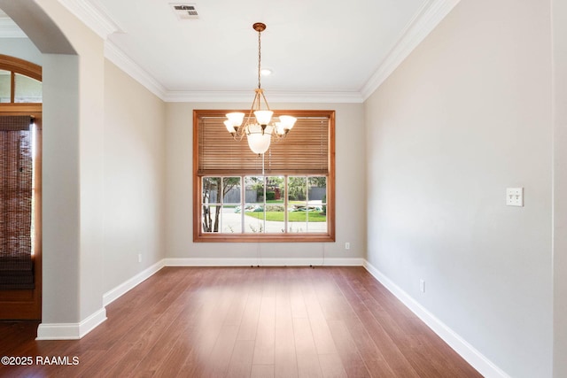 103 Barronne St, Lafayette, LA 70503 - empty room with a chandelier, dark wood-style floors, crown molding, and baseboards