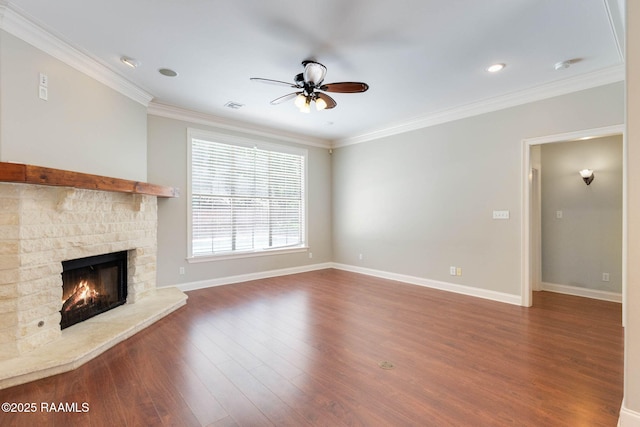 103 Barronne St, Lafayette, LA 70503 - unfurnished living room featuring ceiling fan, wood finished floors, a warm lit fireplace, crown molding, and baseboards