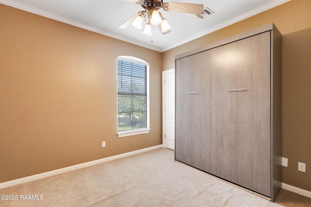 103 Barronne St, Lafayette, LA 70503 - unfurnished bedroom with carpet, baseboards, crown molding, a closet, and ceiling fan