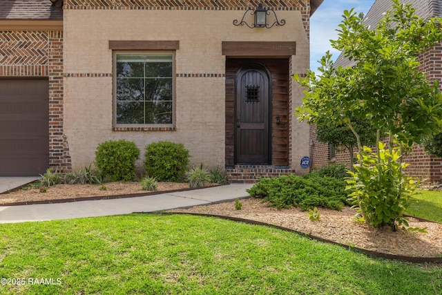 112 Heathwood Dr, Broussard, LA 70518 - doorway to property with brick siding, a yard, and stucco siding