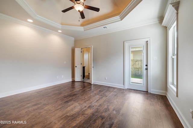 112 Heathwood Dr, Broussard, LA 70518 - spare room with a ceiling fan, dark wood finished floors, a tray ceiling, crown molding, and baseboards