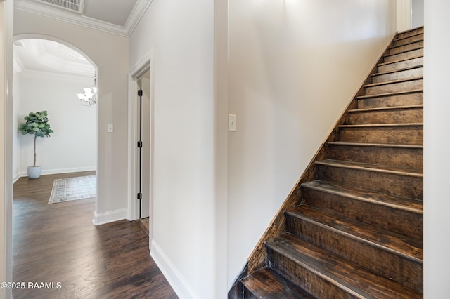 112 Heathwood Dr, Broussard, LA 70518 - stairs featuring crown molding, arched walkways, wood finished floors, and baseboards