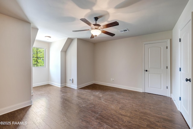 112 Heathwood Dr, Broussard, LA 70518 - bonus room with ceiling fan, dark wood-style flooring, and baseboards