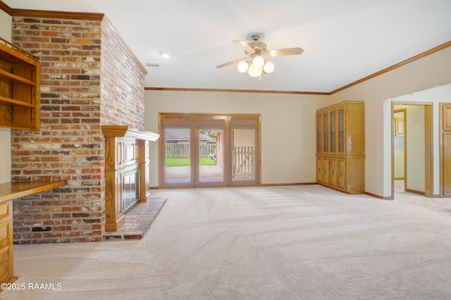 505 River Woods Dr, Lafayette, LA 70508 - unfurnished living room featuring carpet flooring, a ceiling fan, ornamental molding, a fireplace, and baseboards