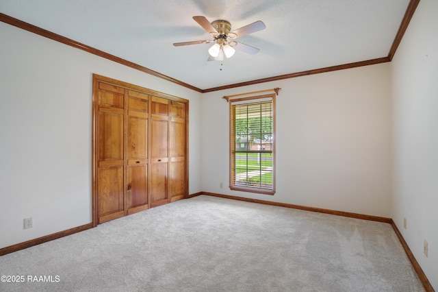 505 River Woods Dr, Lafayette, LA 70508 - unfurnished bedroom featuring carpet, baseboards, crown molding, a closet, and ceiling fan