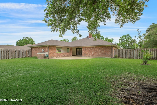 505 River Woods Dr, Lafayette, LA 70508 - back of property featuring a patio area, a chimney, and brick siding