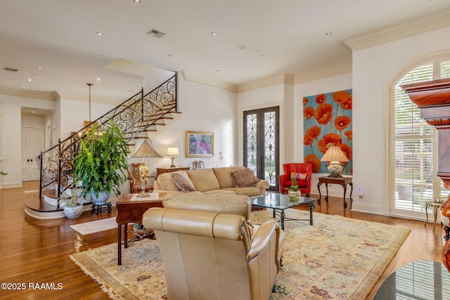 209 Princeton Woods Loop, Lafayette, LA 70508 - living room featuring stairs, wood finished floors, baseboards, crown molding, and recessed lighting
