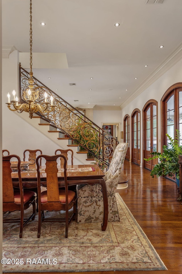 209 Princeton Woods Loop, Lafayette, LA 70508 - dining area with stairway, crown molding, wood finished floors, a chandelier, and recessed lighting