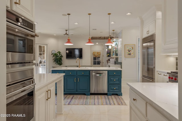 209 Princeton Woods Loop, Lafayette, LA 70508 - kitchen with stainless steel appliances, blue cabinetry, a sink, white cabinetry, and decorative light fixtures