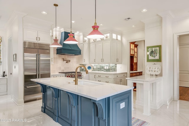 209 Princeton Woods Loop, Lafayette, LA 70508 - kitchen featuring stainless steel built in fridge, a sink, premium range hood, white cabinets, and decorative backsplash