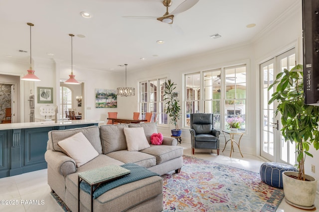 209 Princeton Woods Loop, Lafayette, LA 70508 - living room with healthy amount of natural light, light tile patterned floors, ceiling fan, a chandelier, and ornamental molding