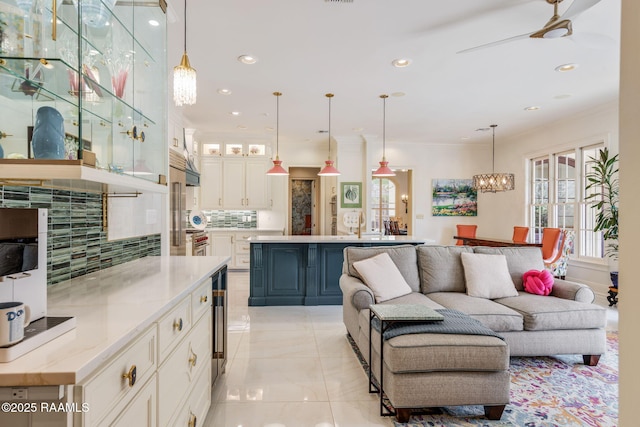 209 Princeton Woods Loop, Lafayette, LA 70508 - living area with a chandelier, recessed lighting, ornamental molding, and ceiling fan