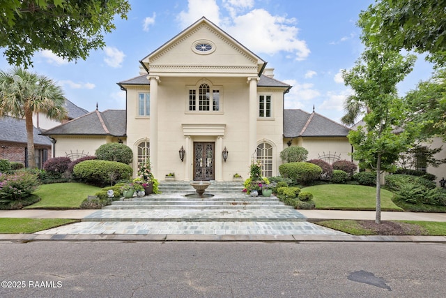 209 Princeton Woods Loop, Lafayette, LA 70508 - greek revival house with a front lawn and french doors