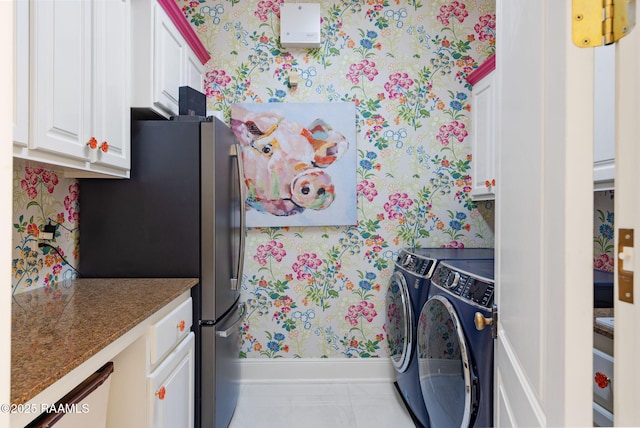 209 Princeton Woods Loop, Lafayette, LA 70508 - laundry area featuring wallpapered walls, cabinet space, washer and dryer, and baseboards
