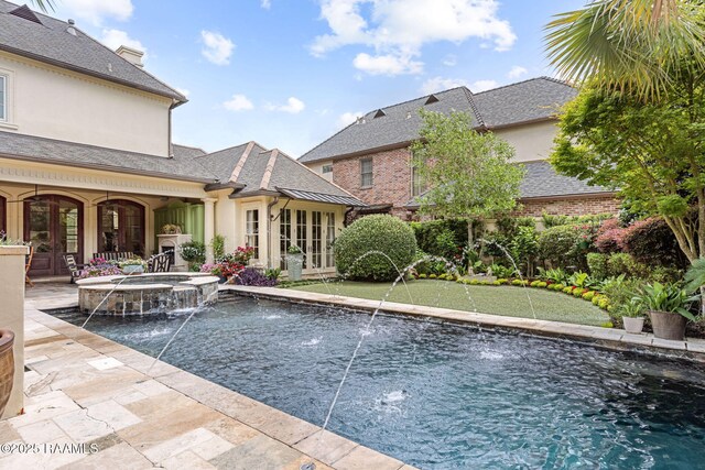209 Princeton Woods Loop, Lafayette, LA 70508 - view of swimming pool with a putting green, french doors, a pool with connected hot tub, and a patio area