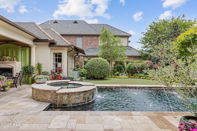209 Princeton Woods Loop, Lafayette, LA 70508 - view of pool featuring a patio, a pool with connected hot tub, and an outdoor fireplace