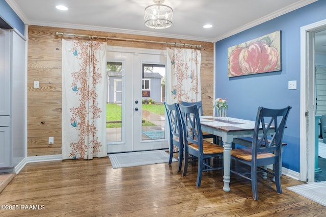 209 Irene Cir, Lafayette, LA 70503 - dining room with french doors, ornamental molding, wood finished floors, baseboards, and a chandelier